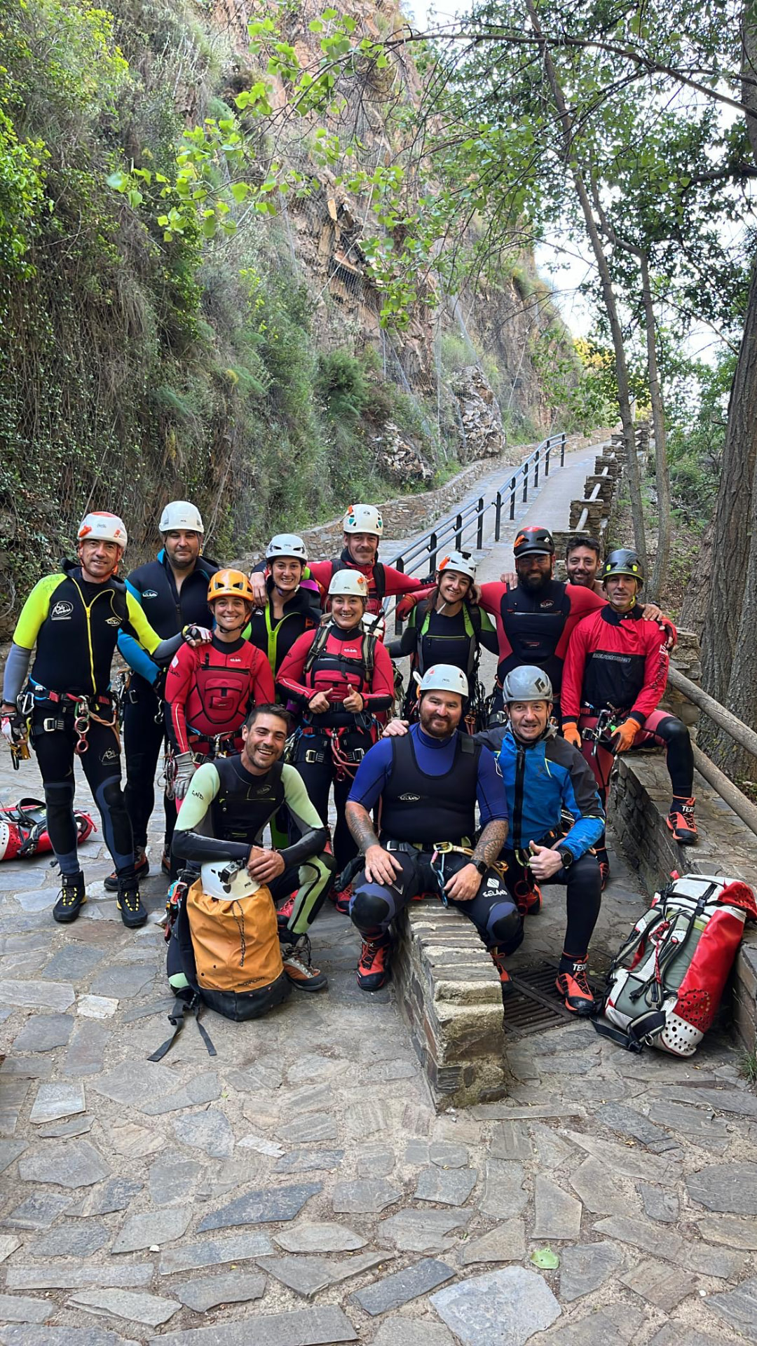 Academy course group in wetsuits and harnesses in a gorge
